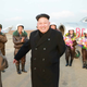 Image for article titled Kim Jong Un Visits Female Fighter Pilots, Picks Up Camera For Photo Op
